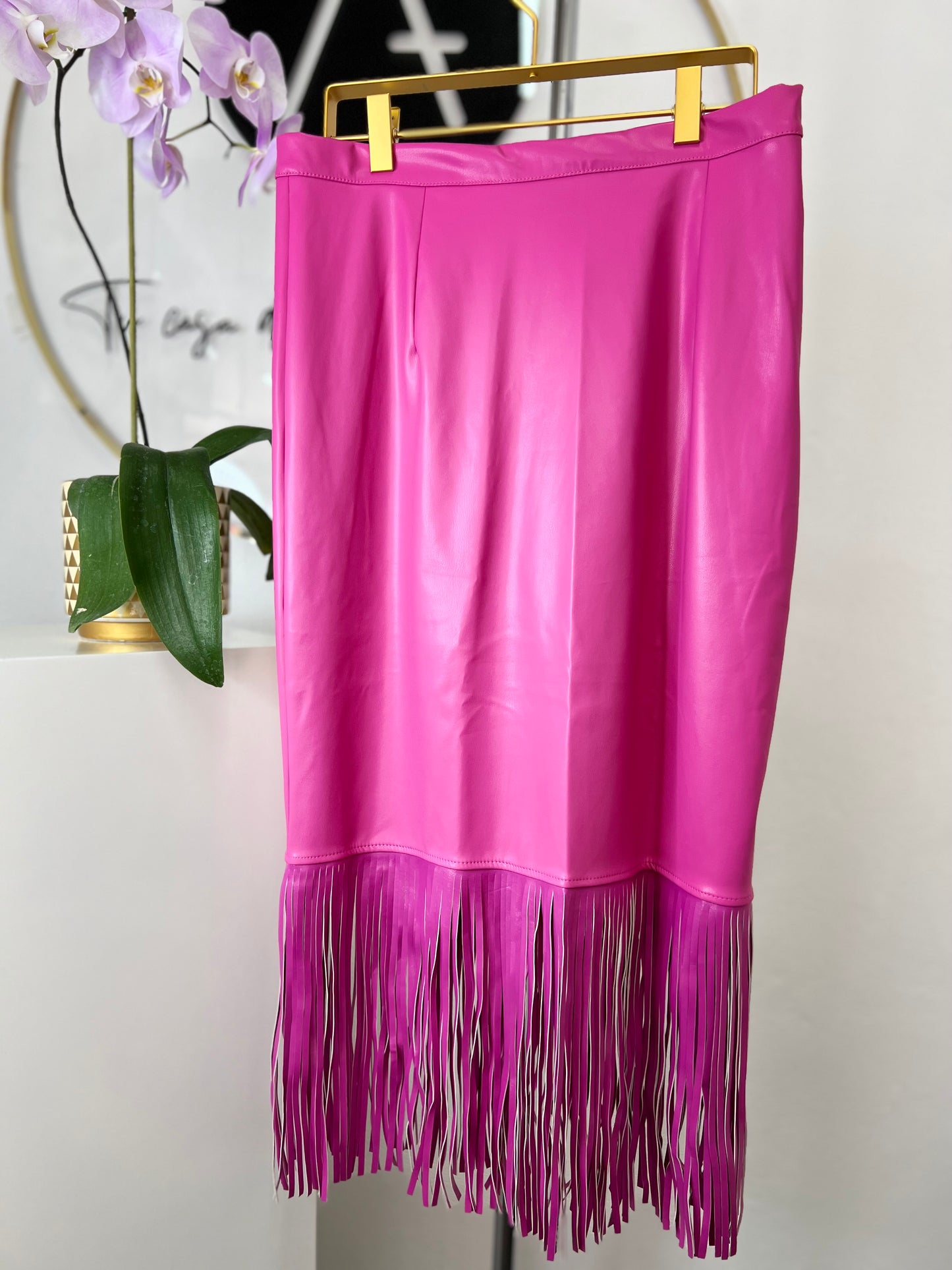 Falda vinipiel rosa flecos