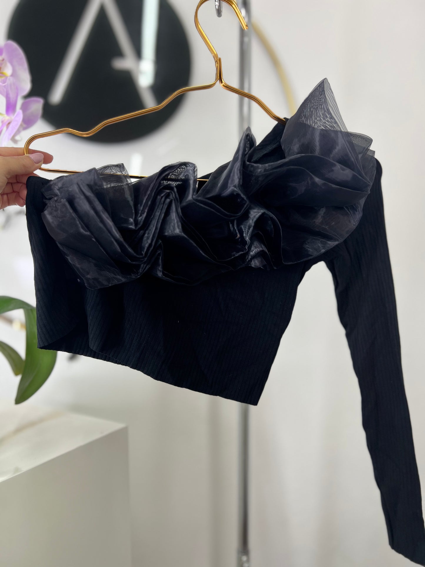 Blusa asimétrica negra