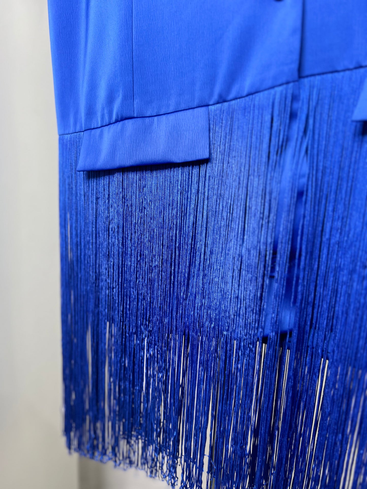 Chaleco flecos azul eléctrico