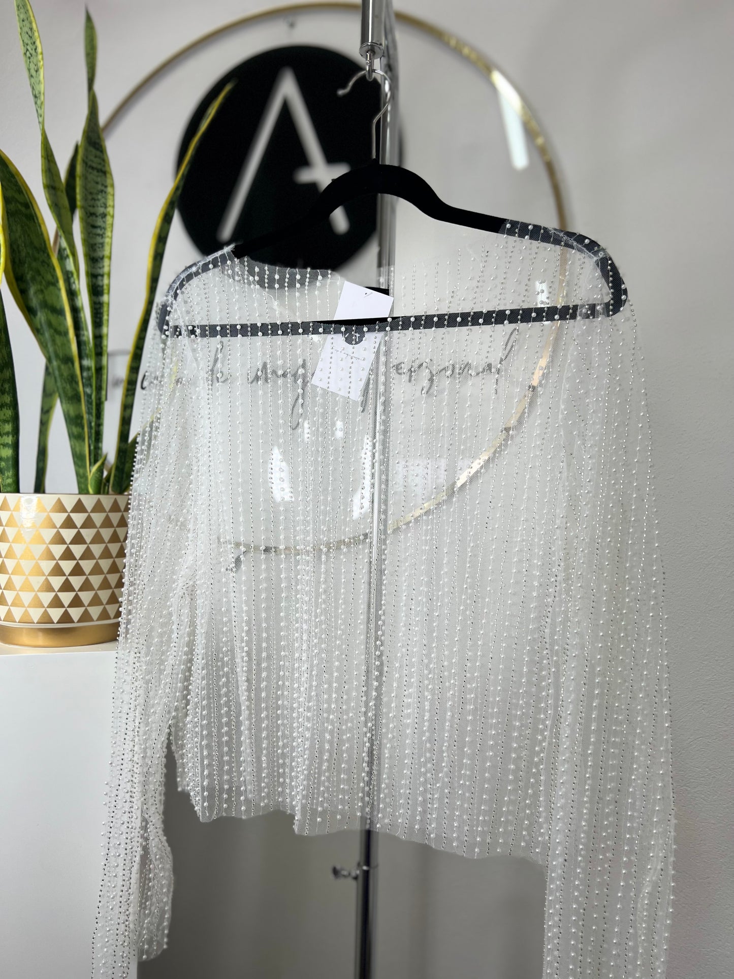 Blusa blanca transparente perlas